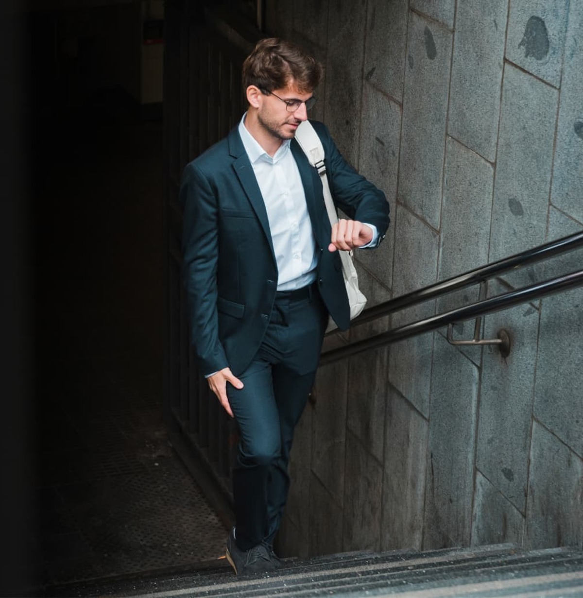 Professional walking out of a metro station on the way to work